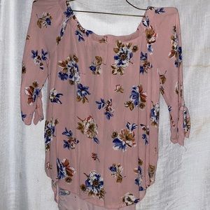 A pink shirt with flower design size medium